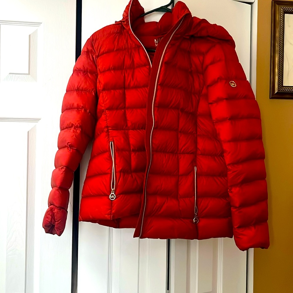 Lightly worn Michael Khors orange woman’s winter coat